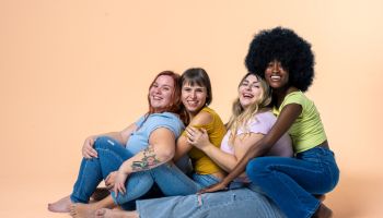 Body Positive and Acceptance, multiracial group of happy women with different body and ethnicity posing together to show the woman power and strength, curvy, plus size and skinny kind of female body concept