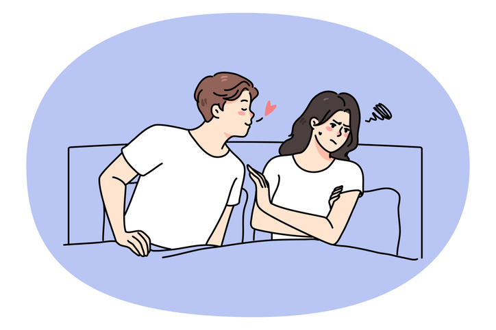 Couple lying in bed have relationship problems