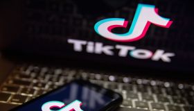In this photo illustration, a TikTok logo seen displayed on...