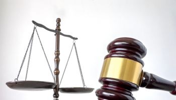 Wood gavel and scale of justice